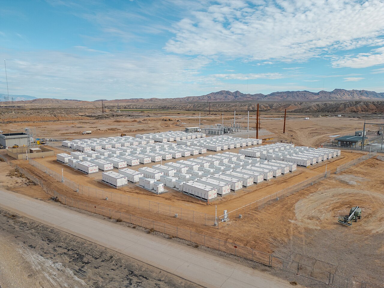 Utility-scale battery storage array connected to power-grid infrastructure